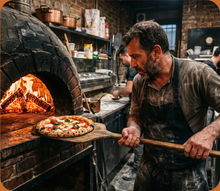 Chef preparing pizzas in the kitchen